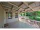 Covered back porch with wooden deck and wooded views at 5138 Foley Dr, Hickory, NC 28601