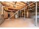 Unfinished basement with storage shelving and stairs at 5138 Foley Dr, Hickory, NC 28601