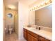 Bathroom with single vanity, shower/tub combo and tile flooring at 5138 Foley Dr, Hickory, NC 28601
