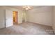 Spacious bedroom with ceiling fan and access to hallway at 5138 Foley Dr, Hickory, NC 28601
