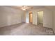 Large bedroom with ceiling fan and multiple doors at 5138 Foley Dr, Hickory, NC 28601