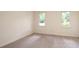 Spacious bedroom with neutral carpeting and two windows at 5138 Foley Dr, Hickory, NC 28601