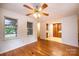 Open dining room and kitchen with hardwood floors and ceiling fan at 5138 Foley Dr, Hickory, NC 28601