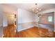 Dining room with hardwood floors, chandelier, and access to kitchen and living room at 5138 Foley Dr, Hickory, NC 28601