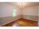 Bright dining room with hardwood floors and a chandelier at 5138 Foley Dr, Hickory, NC 28601