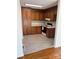 Galley kitchen with wood cabinets and light grey flooring at 5138 Foley Dr, Hickory, NC 28601