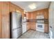 Kitchen with light wood cabinets and appliances at 529 Kingfield Sw Dr, Concord, NC 28027