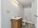 Bathroom with wood-look vinyl flooring, a wooden vanity, and a walk-in shower at 6037 Pleasant Grove Rd, Charlotte, NC 28216