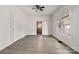 Open-concept living room with views to the hall and bright windows at 6037 Pleasant Grove Rd, Charlotte, NC 28216