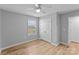 Bedroom with hardwood floors, window, neutral paint, and a closet at 6101 Bunn Simpson Rd, Marshville, NC 28103