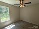 Bright bedroom with a large window, fresh paint and new laminate flooring at 629 S Caldwell St, Salisbury, NC 28144