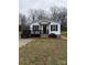 Charming single-story home featuring a small front porch with black railings and shutters at 629 S Caldwell St, Salisbury, NC 28144