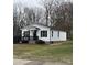 Quaint single-story house displaying crisp white siding, black trim, and a cozy front porch at 629 S Caldwell St, Salisbury, NC 28144