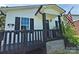 Close up view of cozy front porch, American flag and black trim at 629 S Caldwell St, Salisbury, NC 28144