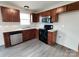 Modern kitchen featuring stainless steel appliances, dark cabinetry and solid surface counters at 629 S Caldwell St, Salisbury, NC 28144