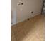 Unfinished laundry room features tiled flooring and dryer hookups at 629 S Caldwell St, Salisbury, NC 28144