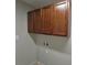 Laundry room featuring upper cabinets, a tile floor, and utility connections, ideal for functionality and organization at 629 S Caldwell St, Salisbury, NC 28144