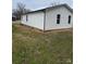 Exterior view of home featuring white siding and well-maintained lawn at 629 S Caldwell St, Salisbury, NC 28144