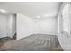Finished basement room with gray carpeting and exterior access at 7011 Jane Parks Way, Charlotte, NC 28217