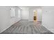 Spacious basement room with gray carpet and exterior access at 7011 Jane Parks Way, Charlotte, NC 28217