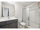 Clean bathroom with gray vanity and a shower at 7011 Jane Parks Way, Charlotte, NC 28217