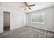 Charming bedroom with a ceiling fan and walk-in closet at 7011 Jane Parks Way, Charlotte, NC 28217