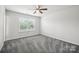 Bedroom with ceiling fan and window coverings at 7011 Jane Parks Way, Charlotte, NC 28217