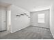 Simple bedroom with gray carpet and shelves at 7011 Jane Parks Way, Charlotte, NC 28217
