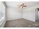 Spacious bedroom with ceiling fan and window at 7011 Jane Parks Way, Charlotte, NC 28217