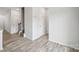 Light and bright entryway with wood-look flooring at 7011 Jane Parks Way, Charlotte, NC 28217