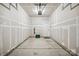 Unfinished garage with overhead door and ample space at 7011 Jane Parks Way, Charlotte, NC 28217