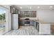 Modern kitchen with gray cabinets, granite counters, and stainless steel appliances at 7011 Jane Parks Way, Charlotte, NC 28217