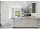 Modern kitchen with gray cabinets, granite counters, and stainless steel appliances at 7011 Jane Parks Way, Charlotte, NC 28217