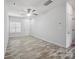 Spacious living room with wood-look floors and ceiling fan at 7011 Jane Parks Way, Charlotte, NC 28217