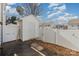 Small backyard with shed and white fence at 7117 Flying Scotsman Dr, Charlotte, NC 28213