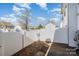 Small backyard with shed and white fence at 7117 Flying Scotsman Dr, Charlotte, NC 28213