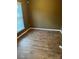 An empty bedroom features hardwood floors and a neutral paint, offering versatility and comfort at 7117 Flying Scotsman Dr, Charlotte, NC 28213