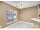 Bright dining area with neutral walls and two windows at 7117 Flying Scotsman Dr, Charlotte, NC 28213