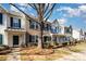 Brick front townhouses with green shutters at 7117 Flying Scotsman Dr, Charlotte, NC 28213