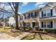 Brick front townhouses with green shutters at 7117 Flying Scotsman Dr, Charlotte, NC 28213