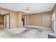 Spacious living room with carpet, fireplace and multiple doors at 7117 Flying Scotsman Dr, Charlotte, NC 28213