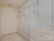 Large walk-in closet with wire shelving and hanging rods at 7117 Flying Scotsman Dr, Charlotte, NC 28213