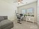 Bright room featuring carpet floors, a ceiling fan, and plenty of natural light from the windows at 7522 Porrera St, Charlotte, NC 28214