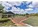 Inviting community area with a covered pavilion, bocce ball courts, and well-maintained landscaping for outdoor enjoyment at 7522 Porrera St, Charlotte, NC 28214