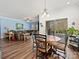 Open dining area with views into the living room and a sliding glass door leading to the outside at 7522 Porrera St, Charlotte, NC 28214