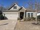 Beautiful home featuring stone accents, a two-car garage, and a well-manicured front yard at 7522 Porrera St, Charlotte, NC 28214