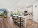 Bright kitchen boasts an island with seating, stainless steel appliances, and modern finishes at 7522 Porrera St, Charlotte, NC 28214