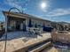 Paver patio with steps, outdoor dining set, grill, and fire pit, ideal for entertaining at 7522 Porrera St, Charlotte, NC 28214