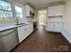 Remodeled kitchen with white cabinets, quartz countertops, and dark hardwood floors at 801 Broad St, Shelby, NC 28152