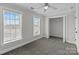 This bedroom has two windows with blinds and an open closet at 922 Houston Heights Rd, Charlotte, NC 28262